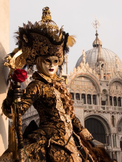 Masked Venetian oustide the Doge's Palace